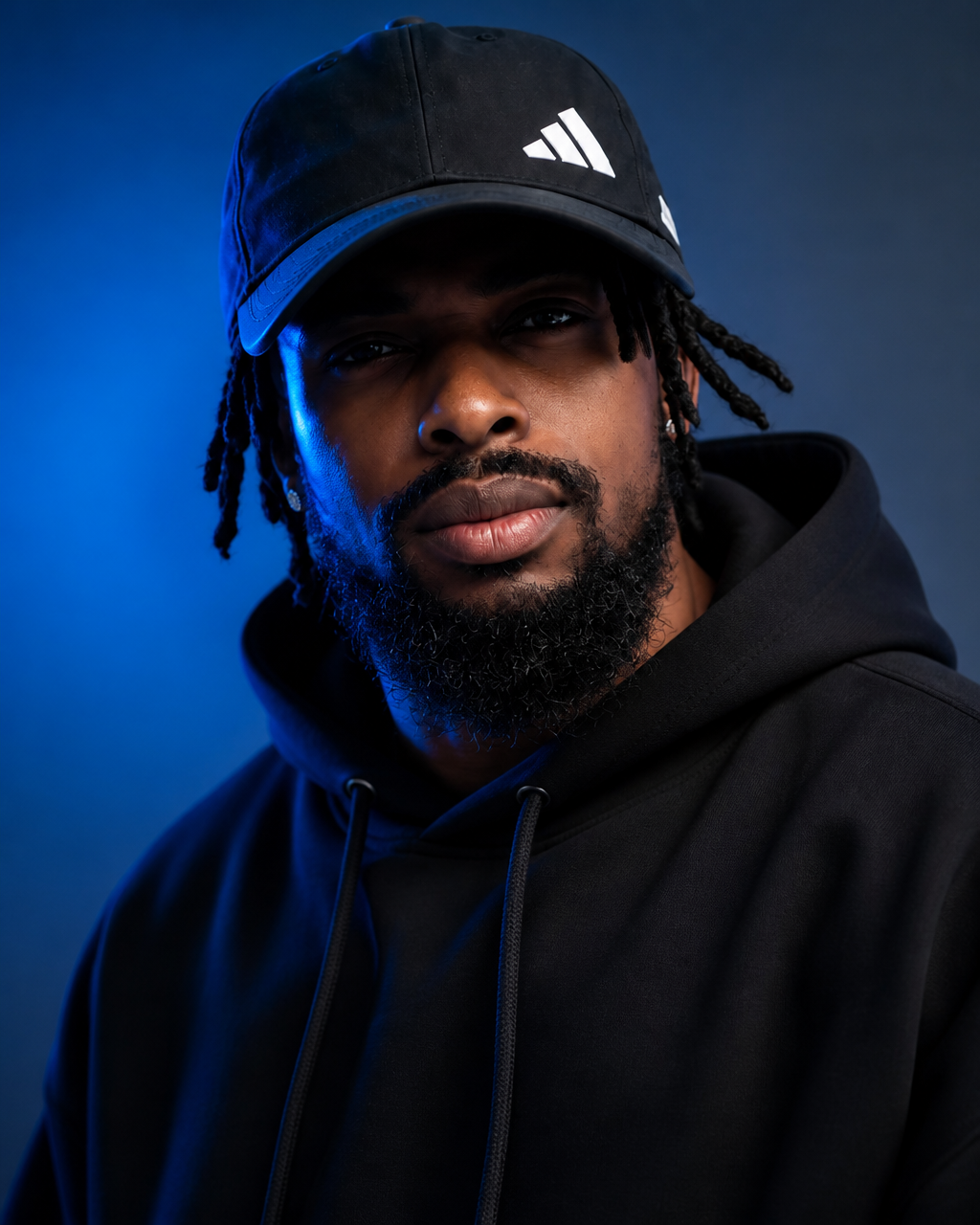 Cinematic Blue-Lit Editorial Portrait in Black Hoodie